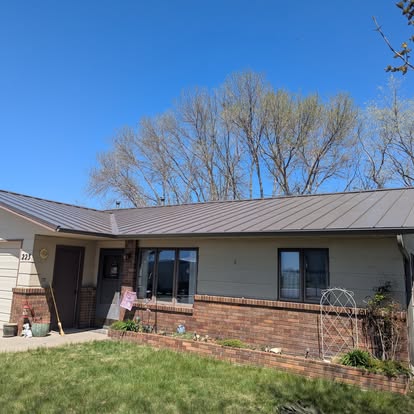 Standing-seam steel roof replacement on a brick ranch, De Smet SD